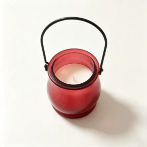 Outdoor citronella-scented candle in a frosted glass lantern with metal handle