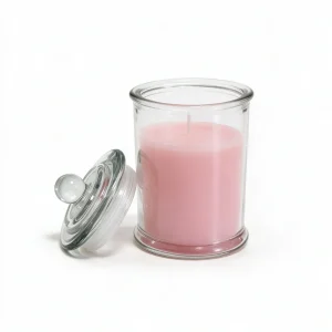 Rose-scented candle in clear glass jar with pink wax